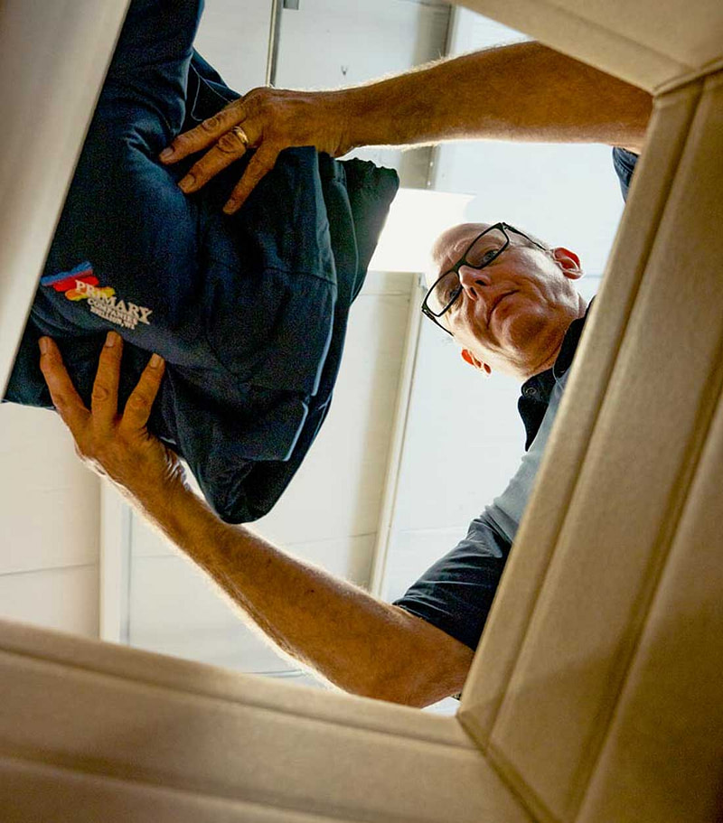 Man Placing Merchandise Inside Box